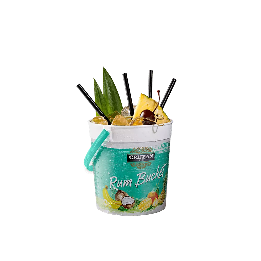 Rum Runner cocktail in a Cruzan® Rum bucket with drinking straws and garnished with a pineapple wedge and cherry.