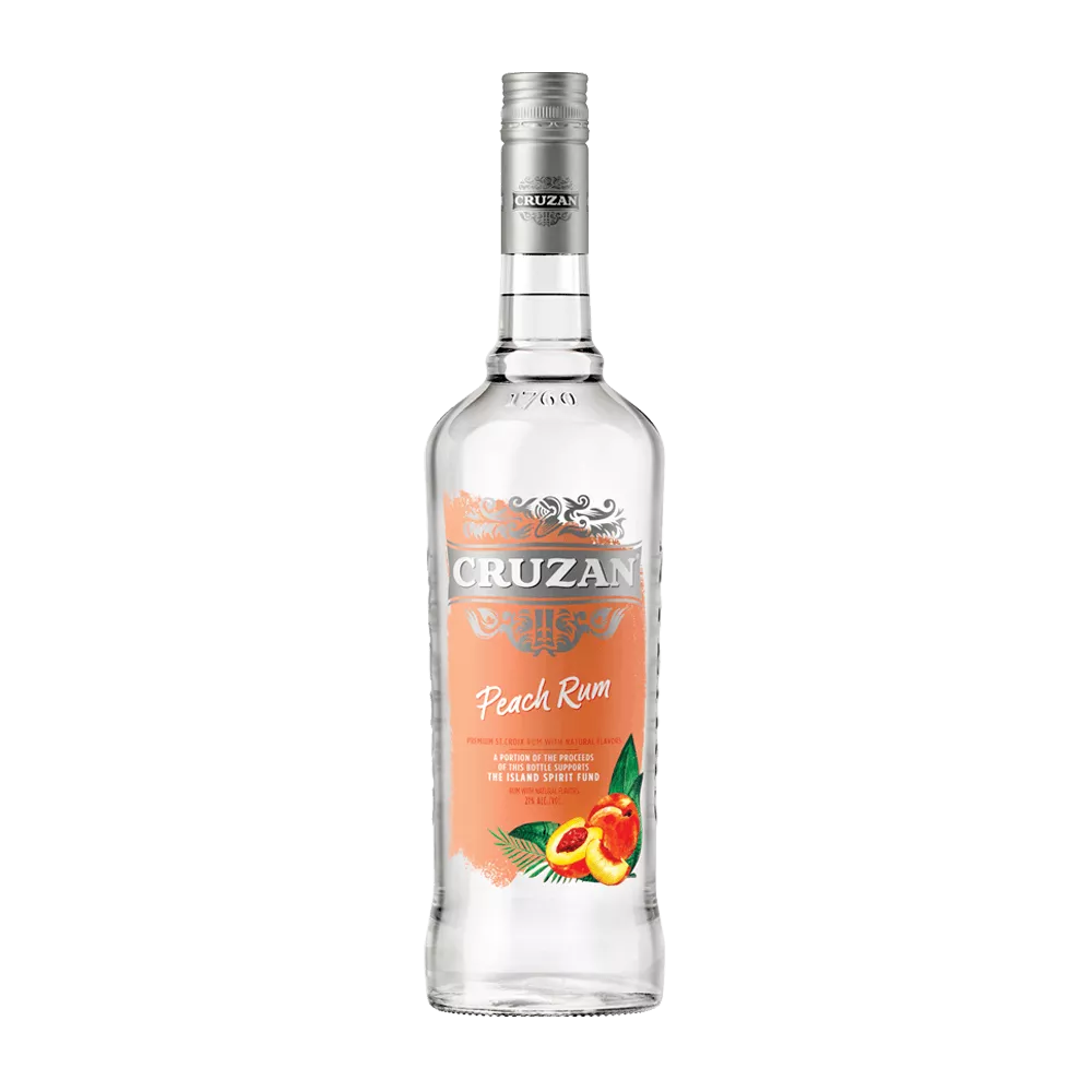 Cruzan Peach Rum glass bottle with a peach colored label adorned with sliced peaches.